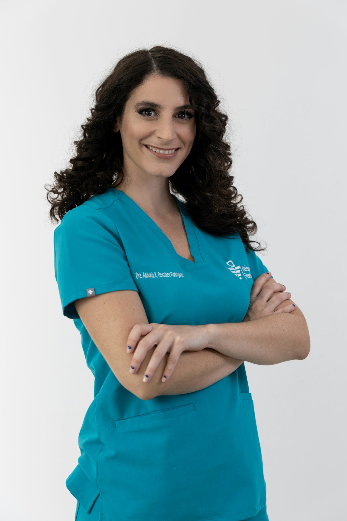 Healthcare professional in teal scrubs